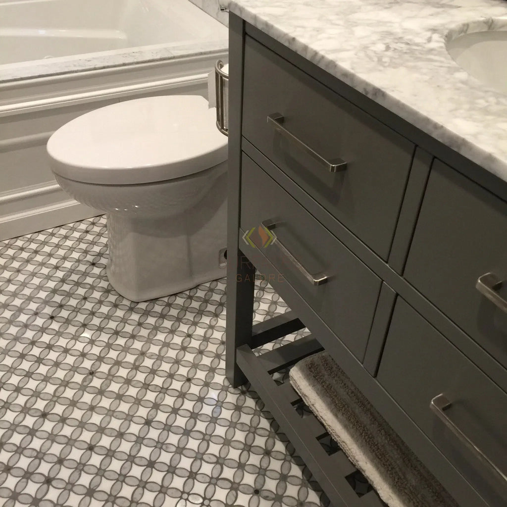 Gray bathroom vanity with marble top paired with Carrara White hexagon mosaic tile