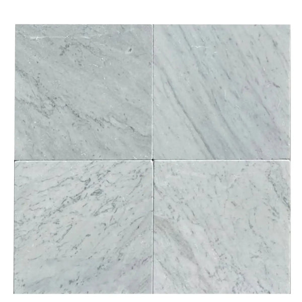 Four Carrara White Marble 12X12 Tumbled tiles showcasing elegant natural textures