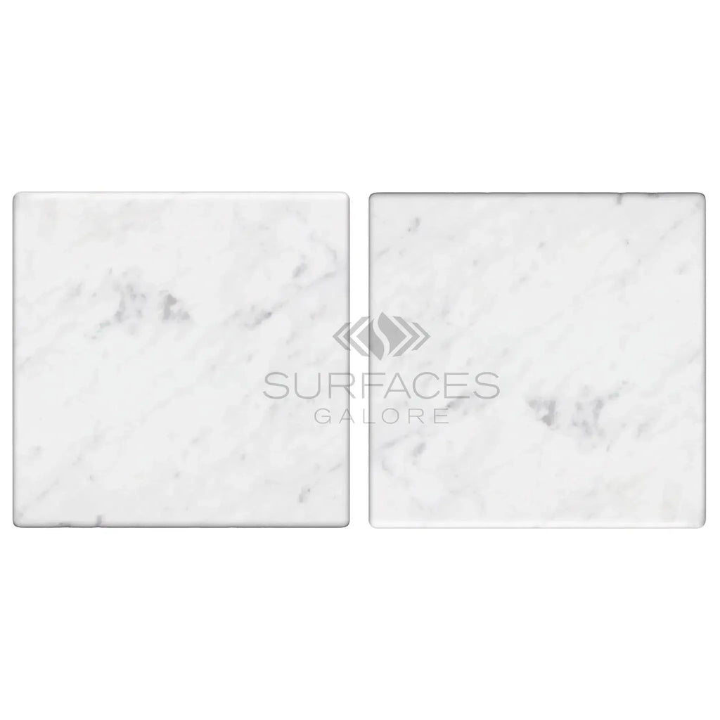 Two Carrara White Marble 4X4 Tumbled square tiles showcasing elegant design