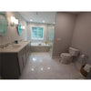 Bathroom featuring double vanity and toilet with Carrara White Vortex Hexagon Tile