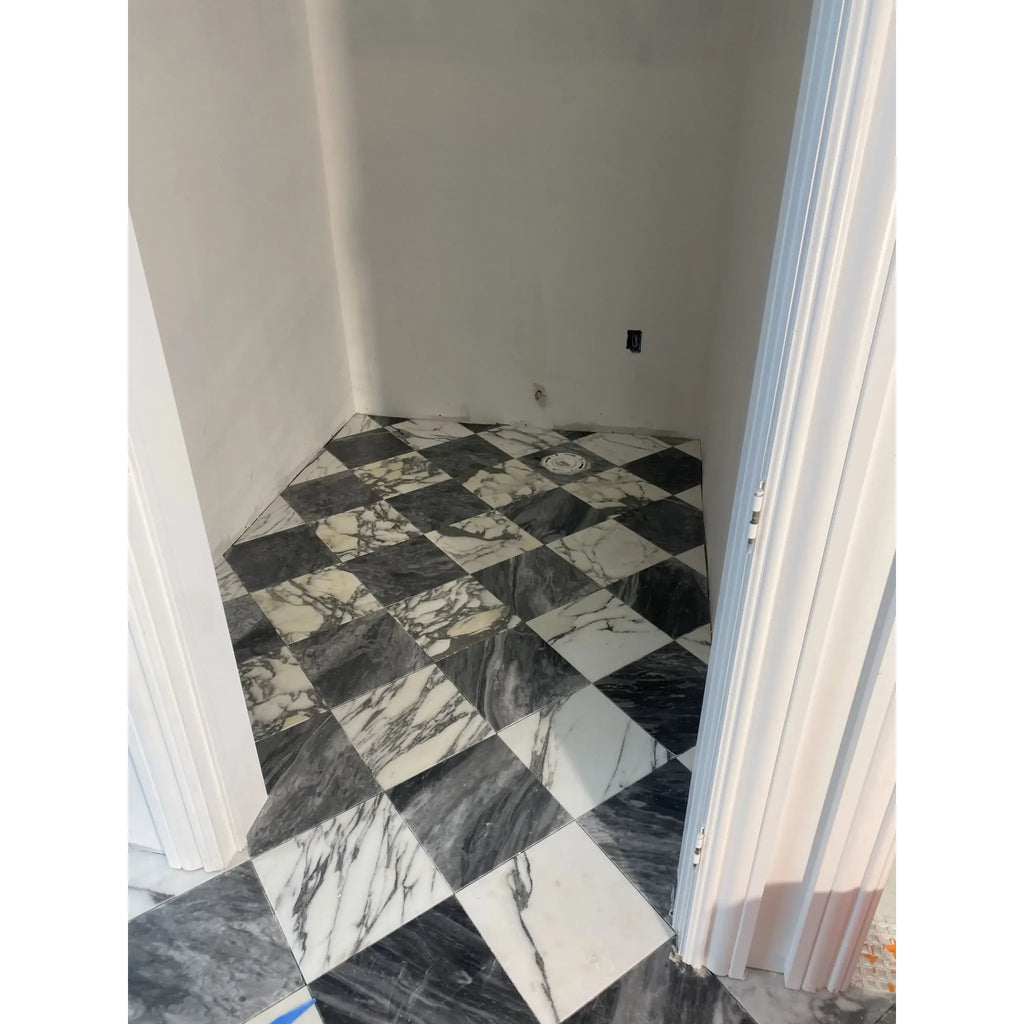 Black and white checkered marble floor featuring Checkerboard Bardiglio and Calacatta Gold