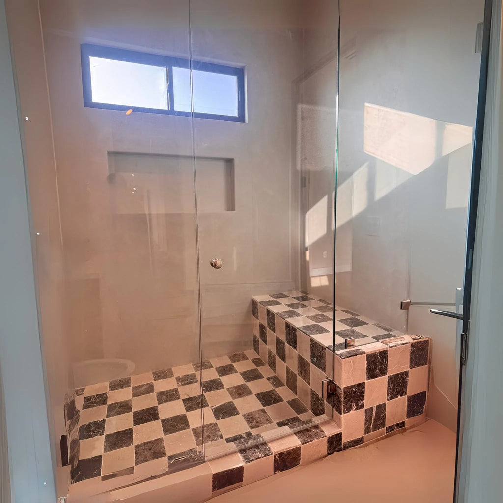 Checkered tile shower with glass enclosure featuring Checkerboard Bardiglio and Calacatta Gold Marble