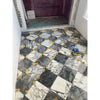 Marble tile floor featuring yellow spacers in Checkerboard Bardiglio and White Onyx set