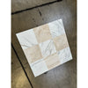 Square tile featuring alternating Calacatta Gold and Diano Royal marble squares