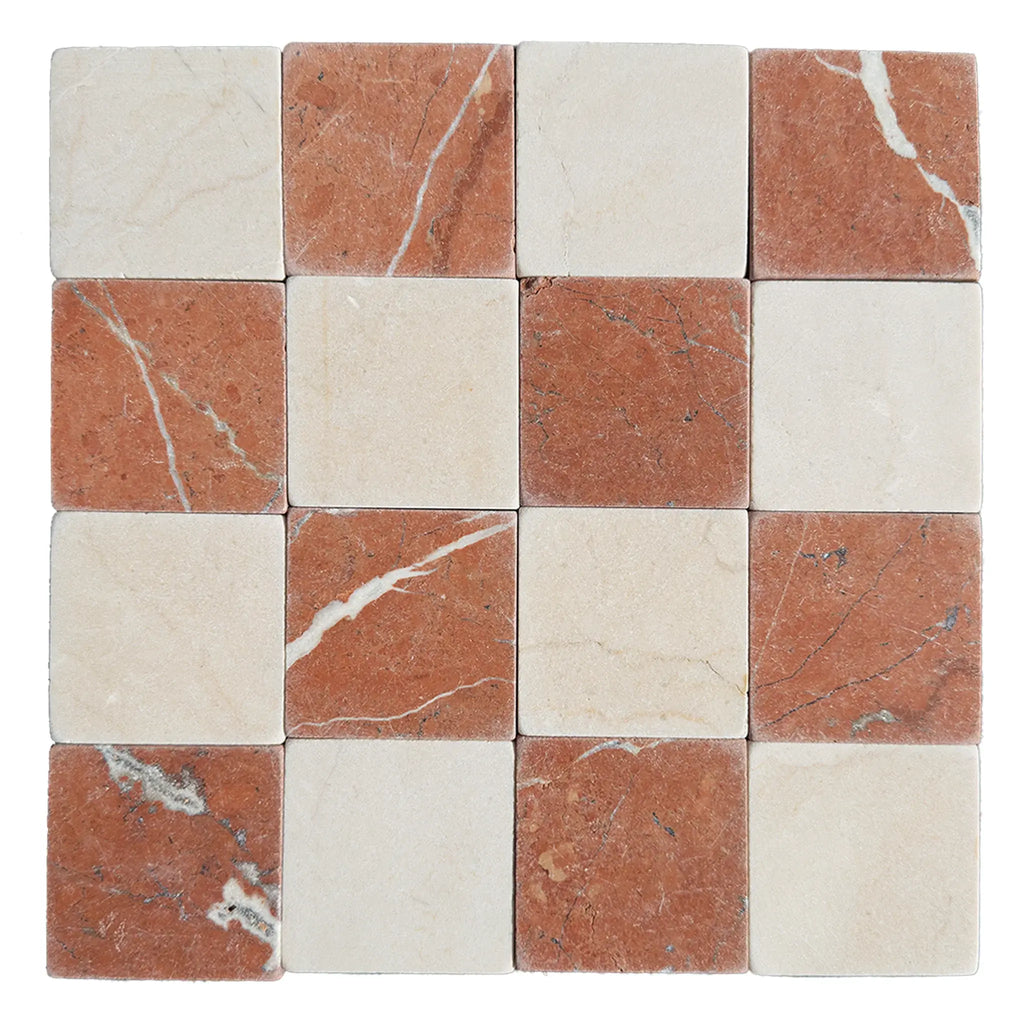 Checkerboard pattern of Crema Marfil and Rojo Alicante marble tiles in tumbled finish