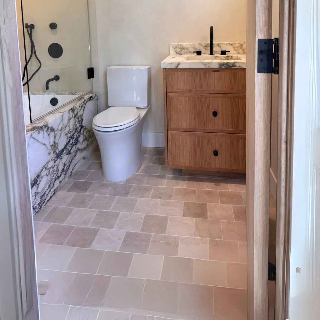 Modern bathroom interior featuring Checkerboard Emperador Dark Marble and Crema Marfil tiles