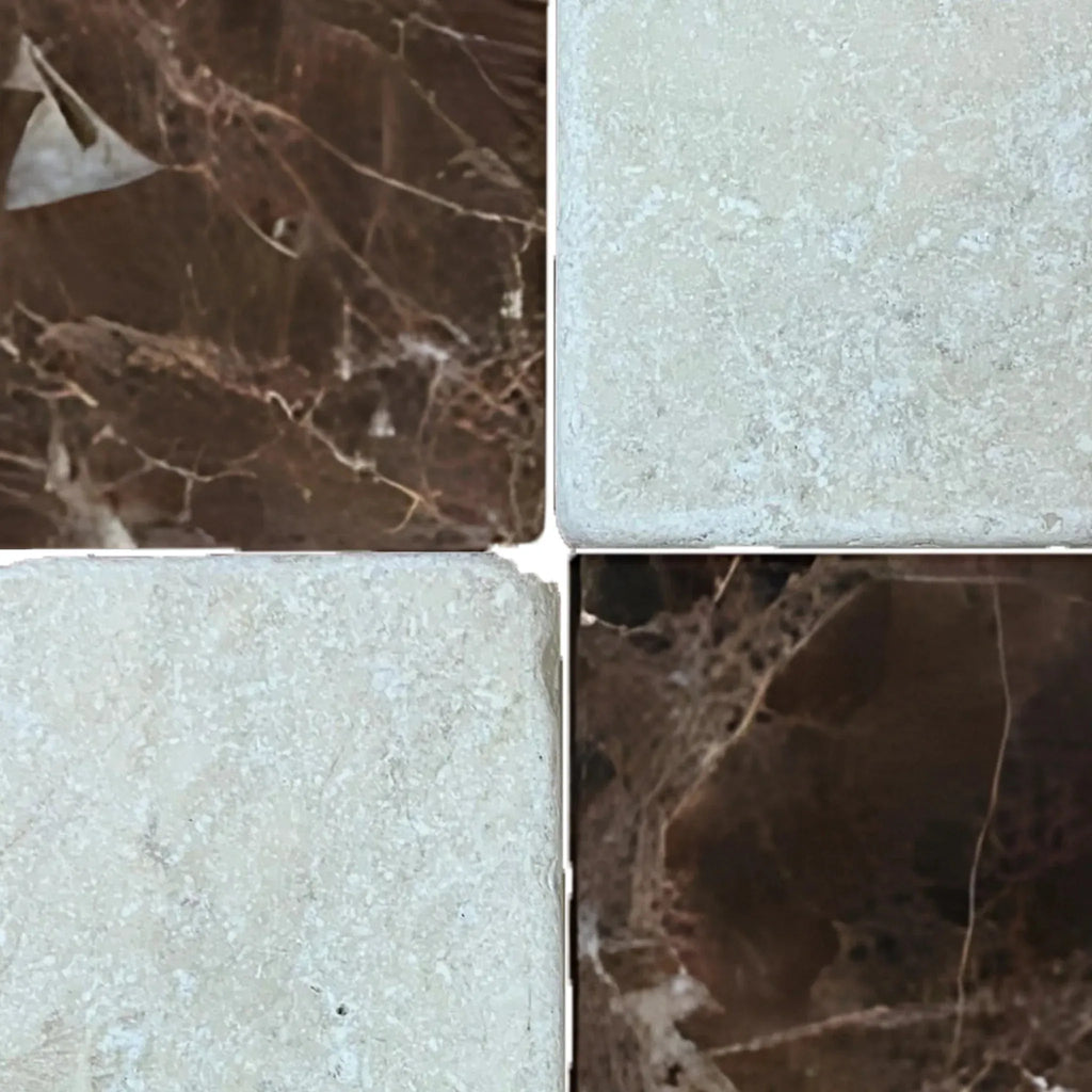 Four marble tiles of Checkerboard Emperador Dark Marble and Crema Marfil Tumbled set