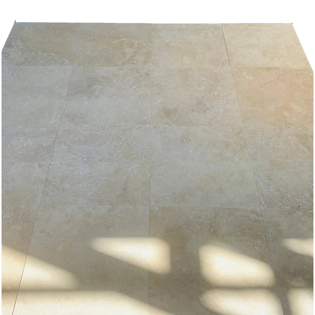 Tiled floor with shadow showcasing Checkerboard Nero Marquina Marble and Ivory Travertine