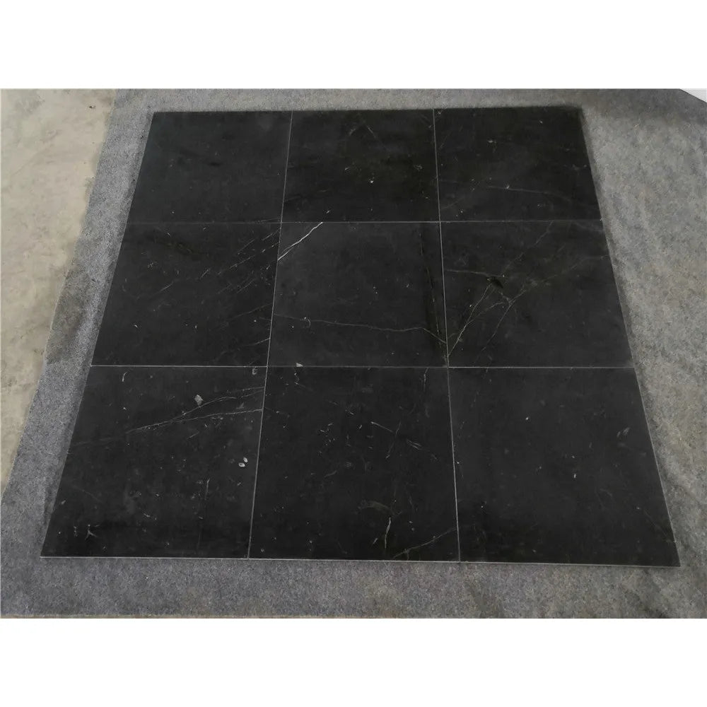 Nine black Nero Marquina marble tiles in Checkerboard Oriental White set