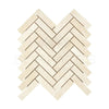 Herringbone pattern of light-colored Crema Marfil Marble 1X4 mosaic tiles