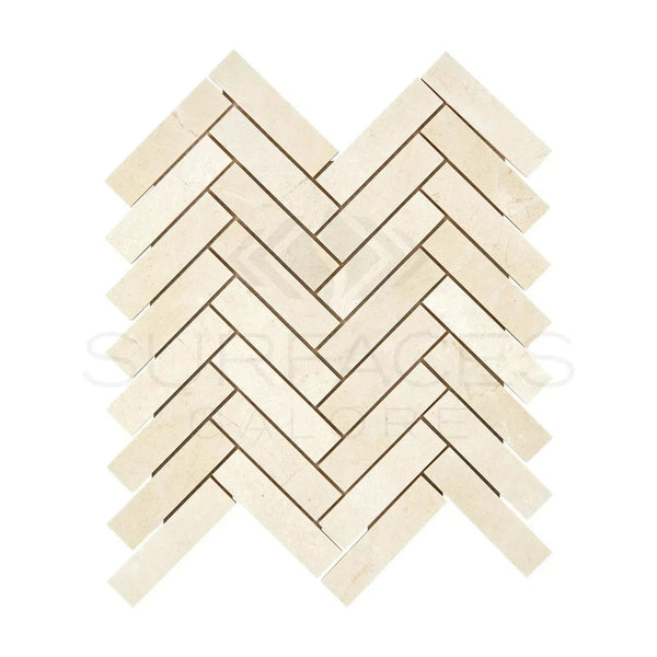 Herringbone pattern of light-colored Crema Marfil Marble 1X4 mosaic tiles