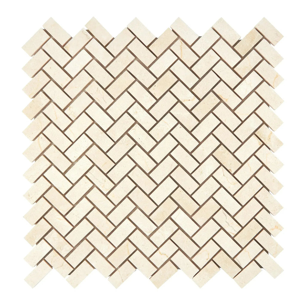 Herringbone pattern of beige Crema Marfil Marble tiles in polished or honed finish