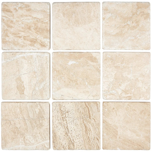 Nine beige Diano Royal Queen Beige Marble 4X4 Tumbled tiles arranged for display