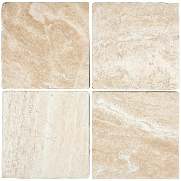 Four beige Diano Royal (Queen Beige) Marble 6X6 Tumbled tiles showcasing elegant design