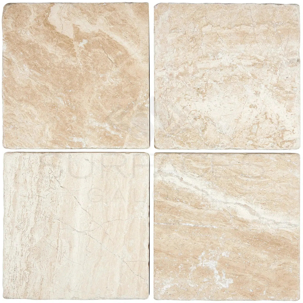 Four beige Diano Royal Marble 6X6 Tumbled tiles arranged elegantly