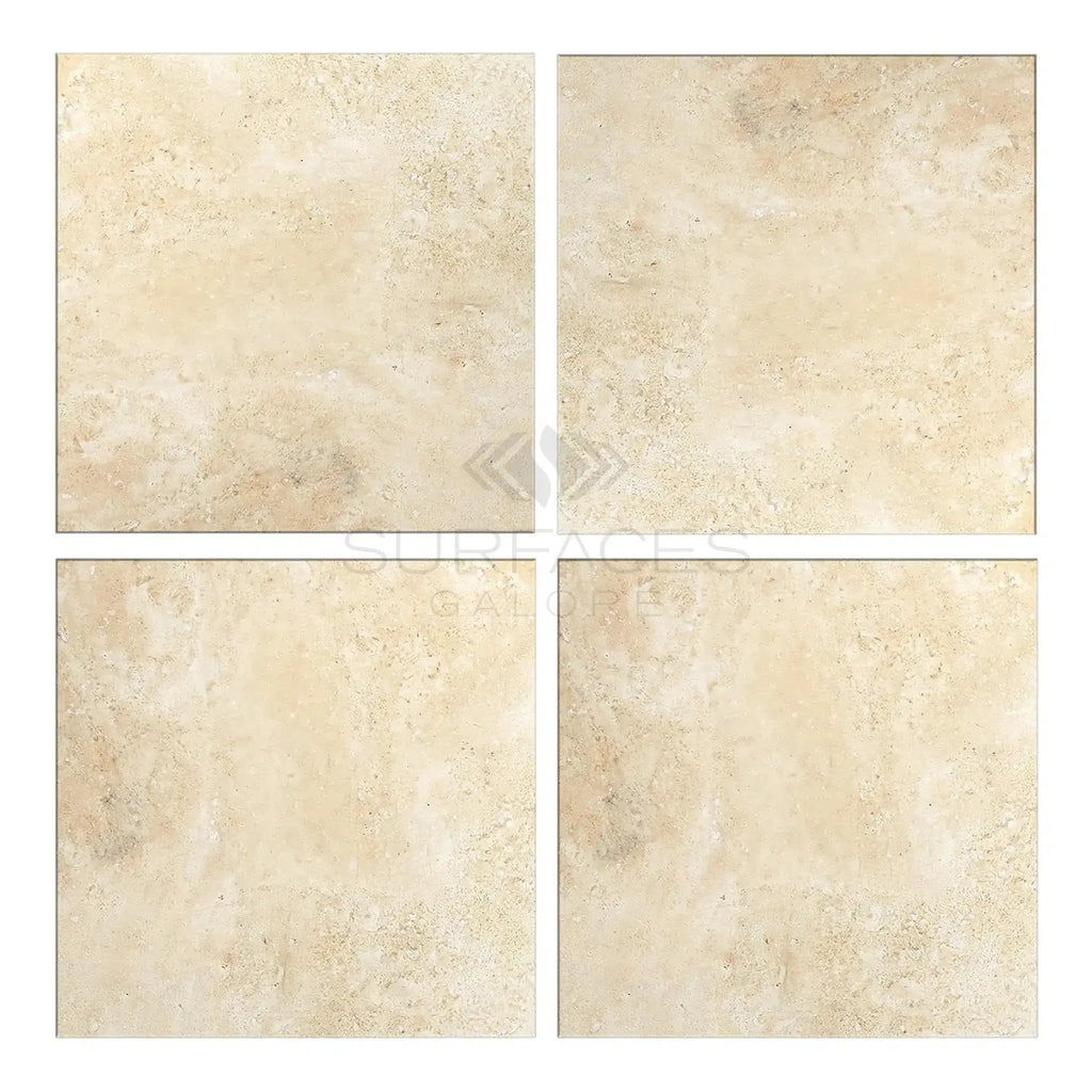 Four beige Durango Paredon Mexican travertine tiles showcased in a 24X24 format