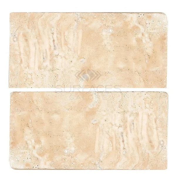 Two Durango/Paredon 8X16 Tumbled Travertine tiles showcasing natural stone texture