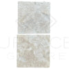 Two textured white stone tiles from the Durango (Santa Fe) 12X12 Tumbled Tile