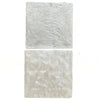 Two textured, square white tiles from Durango Santa Fe 12X12 Tumbled Tile collection