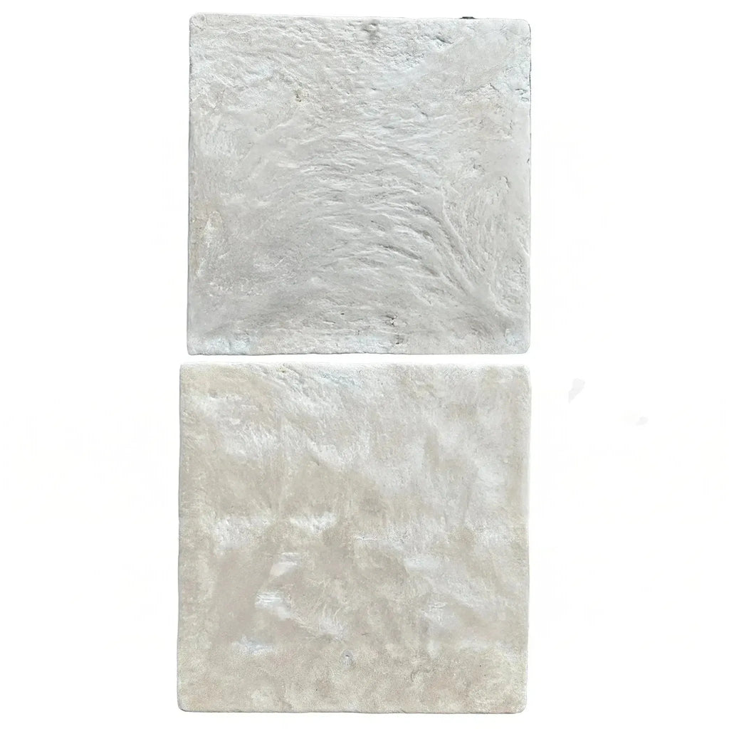 Two textured, square white tiles from Durango Santa Fe 12X12 Tumbled Tile collection