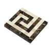 Square mosaic tile featuring a maze pattern in Emperador Dark MarbleGreek Key design