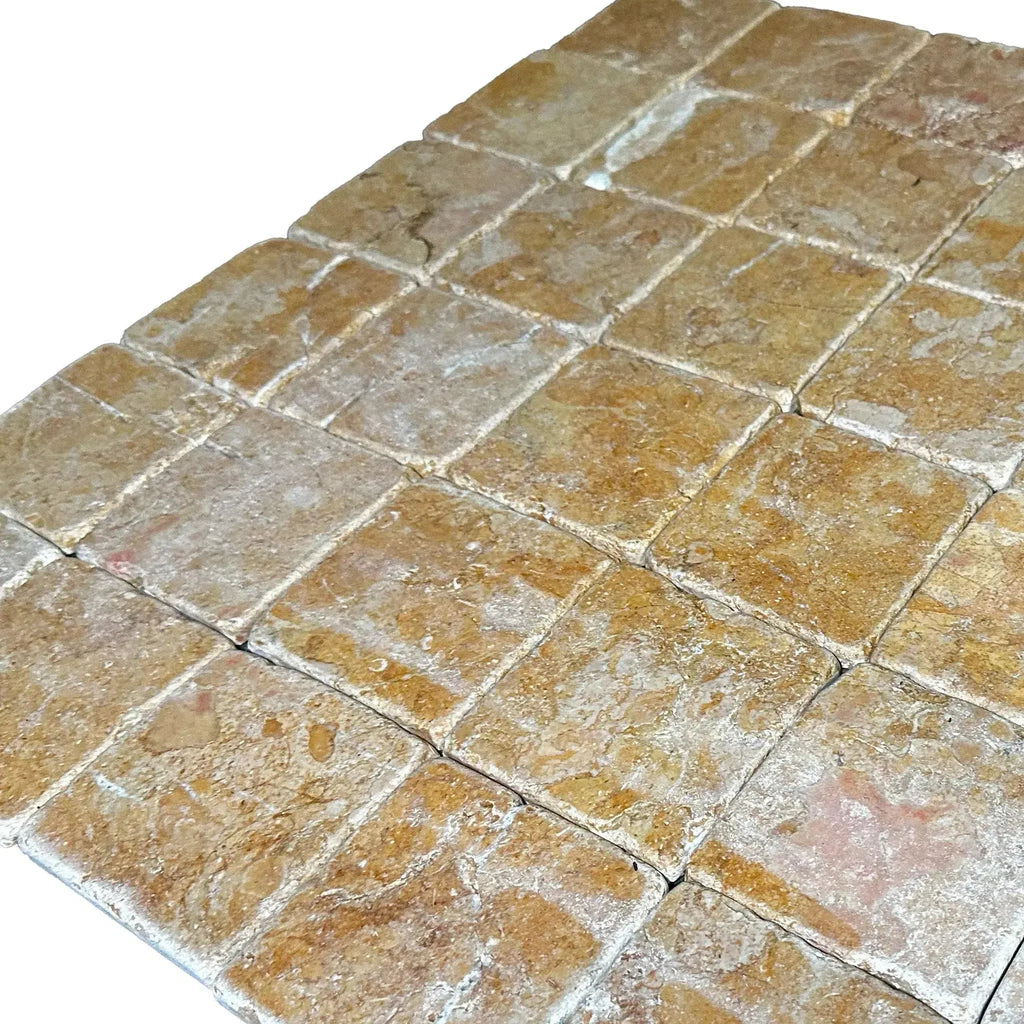 Tumbled travertine tile mosaic showcasing Giallo Reale Gold-Yellow Marble 4X4 tiles