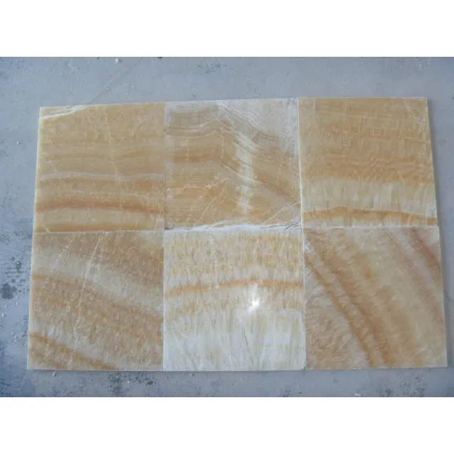 Six polished Honey Onyx tiles in Giallo Crystal pencil liner design