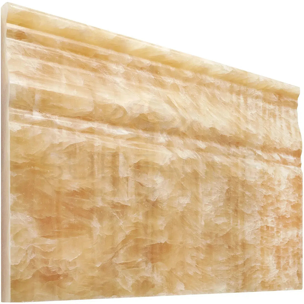 Ornate yellow marble molding in Honey Onyx Giallo Crystal baseboard trim liner