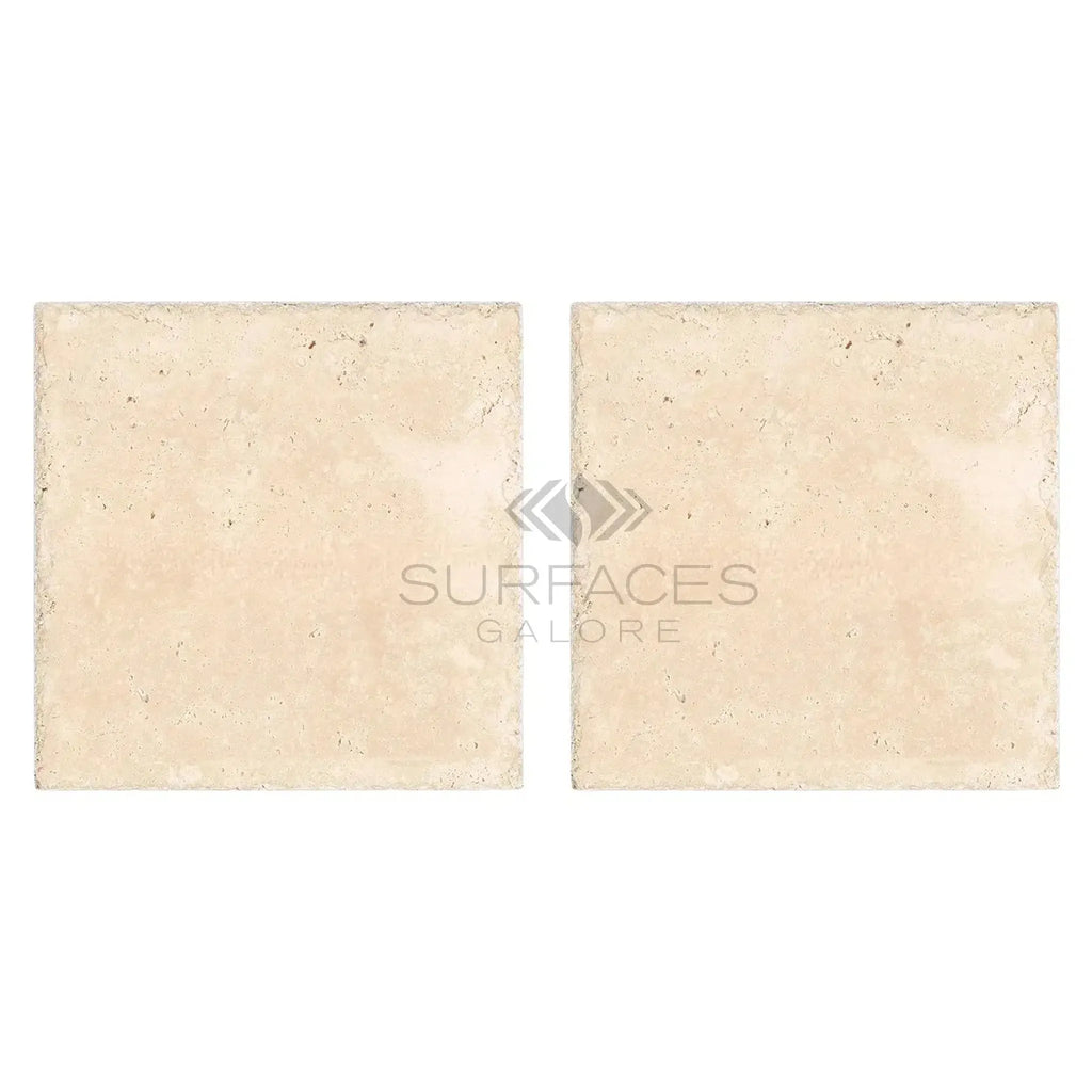 Two square Ivory Travertine 16X16 tiles displayed, showcasing a cross-cut finish