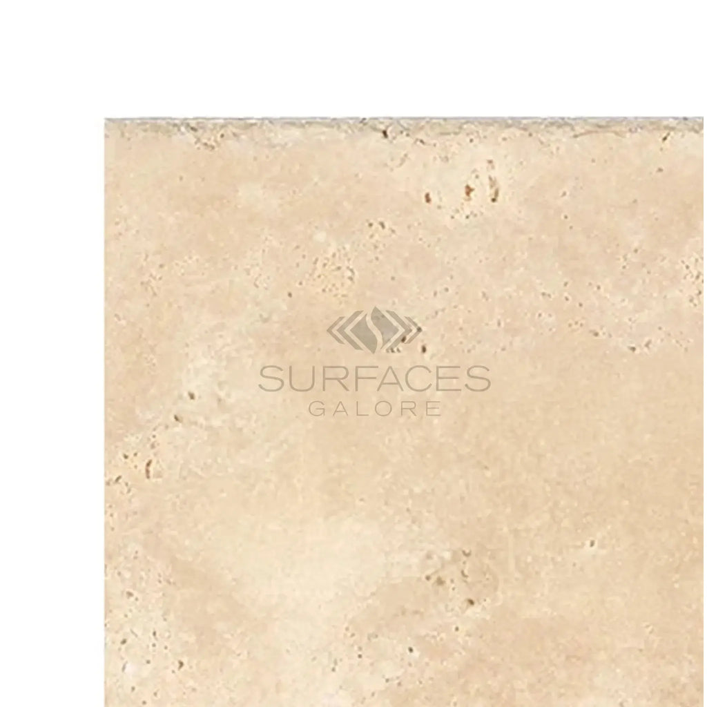 Beige travertine tile in Ivory Light Travertine 16X24 Cross-Cut Brushed and Chiseled