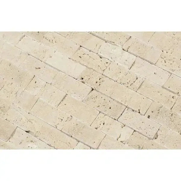 Beige travertine brick pattern in Ivory Light Travertine 1X2 Mosaic Split-Faced