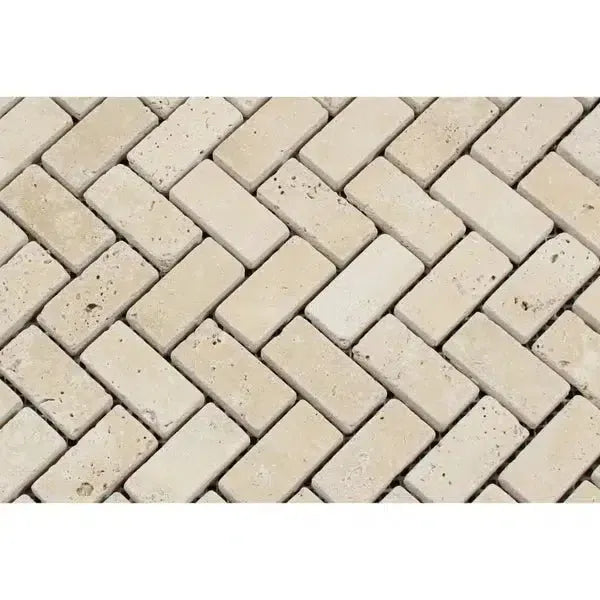 Ivory Travertine 1X2 Herringbone Mosaic Tumbled featuring a classic brick pattern