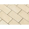 Rectangular beige tiles of Ivory Light Travertine 2X4 Brick Mosaic Filled and Honed