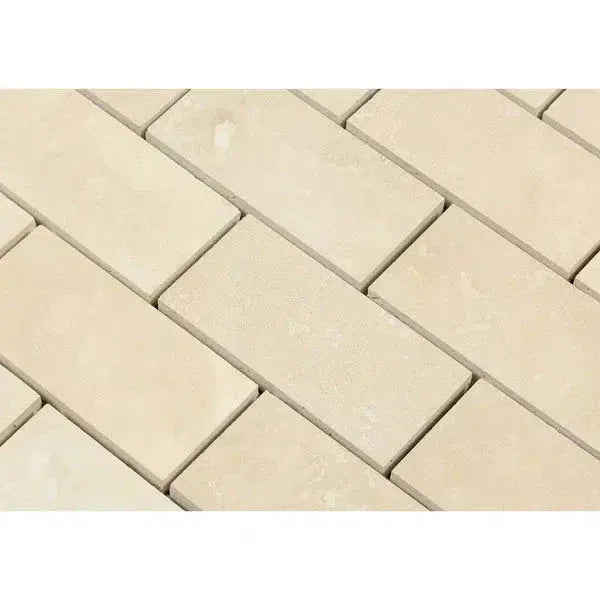 Rectangular beige tiles of Ivory Light Travertine 2X4 Brick Mosaic Filled and Honed