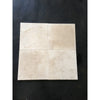 Four beige travertine tiles from Ivory Light Travertine mini-pattern mosaic collection