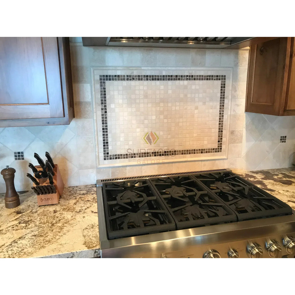 Stainless steel gas range displayed with Ivory Travertine Ledger-Panel in corner setting