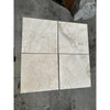 Four square Malibu Travertine 12X24 Filled and Honed marble tiles in display