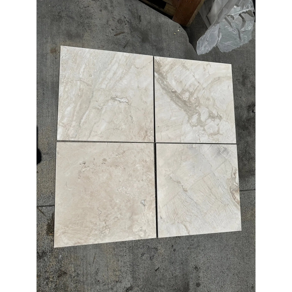 Four square Malibu Travertine 12X24 Filled and Honed marble tiles in display