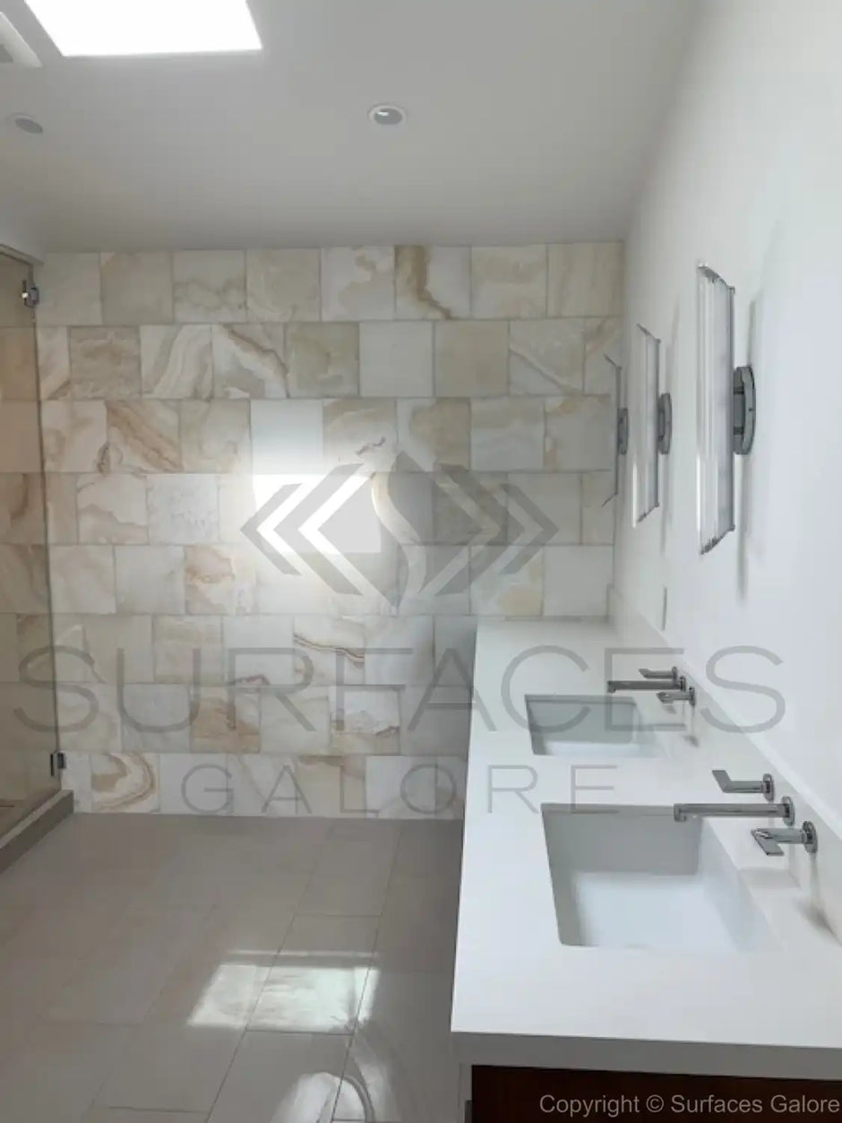 Installed marble and travertine tiles in various spaces like kitchen, bathroom, and living room, showcasing elegant and durable natural stone surfaces