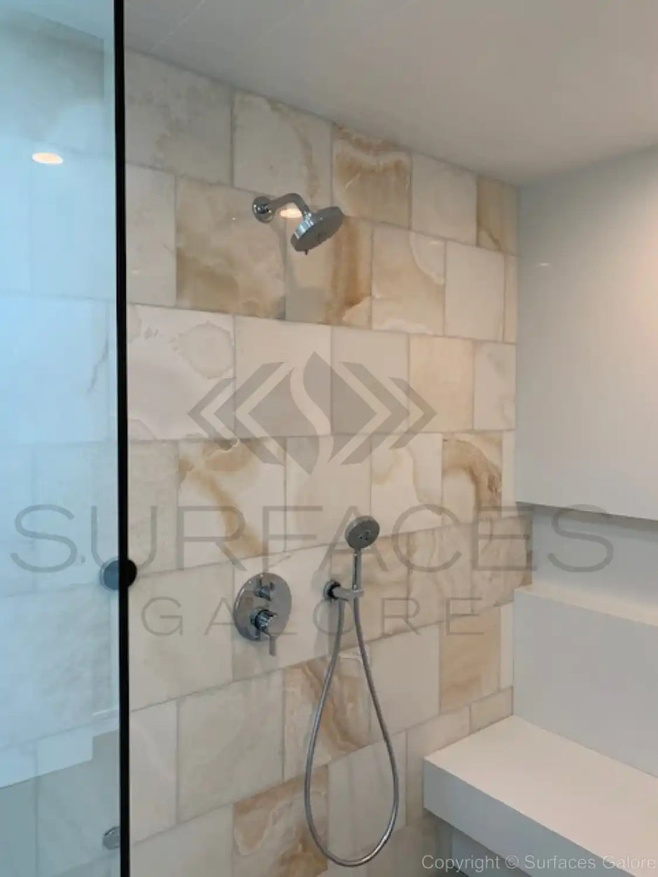 Installed marble and travertine tiles in various spaces like kitchen, bathroom, and living room, showcasing elegant and durable natural stone surfaces