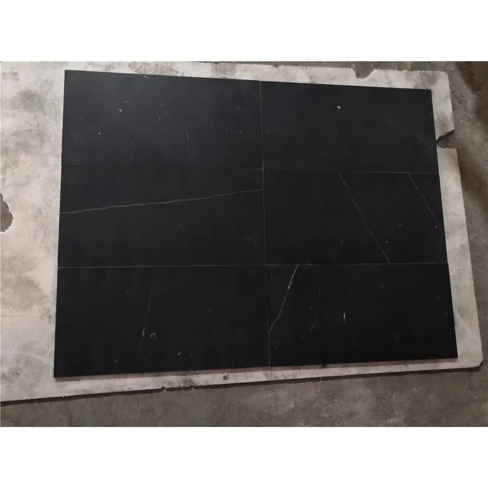 Black marble tiles with white veining in Nero Marquina 1’’ hexagon mosaic design