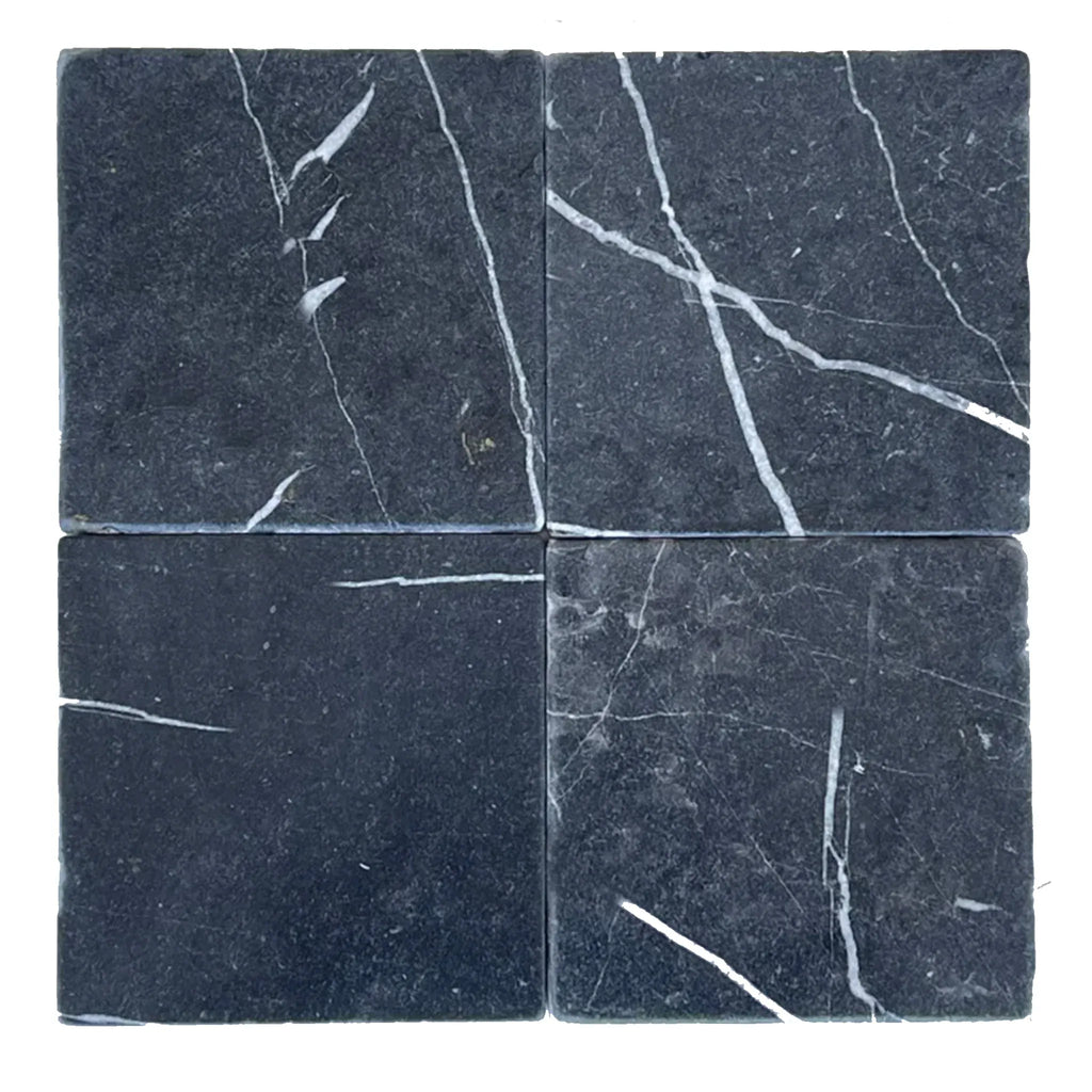 Four black marble tiles of Nero Marquina Marble 12X12 Tumbled design