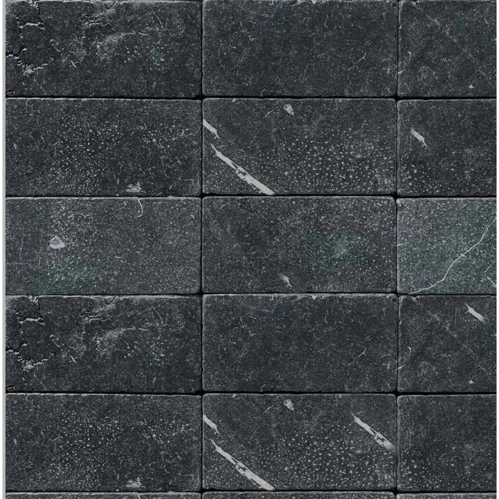 Dark gray marble brick wall featuring Nero Marquina Black Marble 3X6 Tumbled design