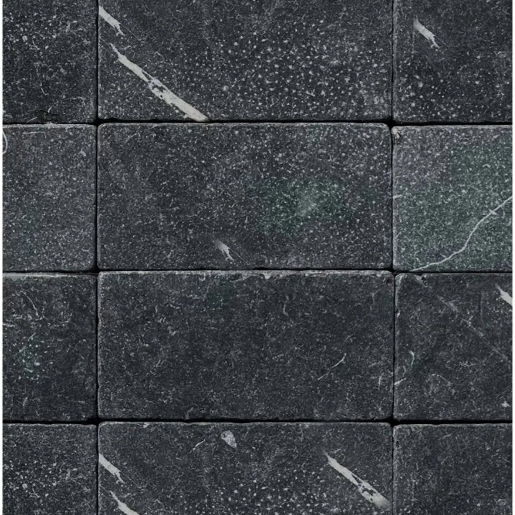 Dark gray marble brick tiles from Nero Marquina/Black Marble 3X6 Tumbled collection