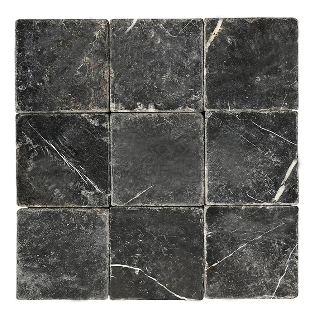 Nine Nero Marquina Black Marble 4X4 Tumbled tiles showcasing elegant design