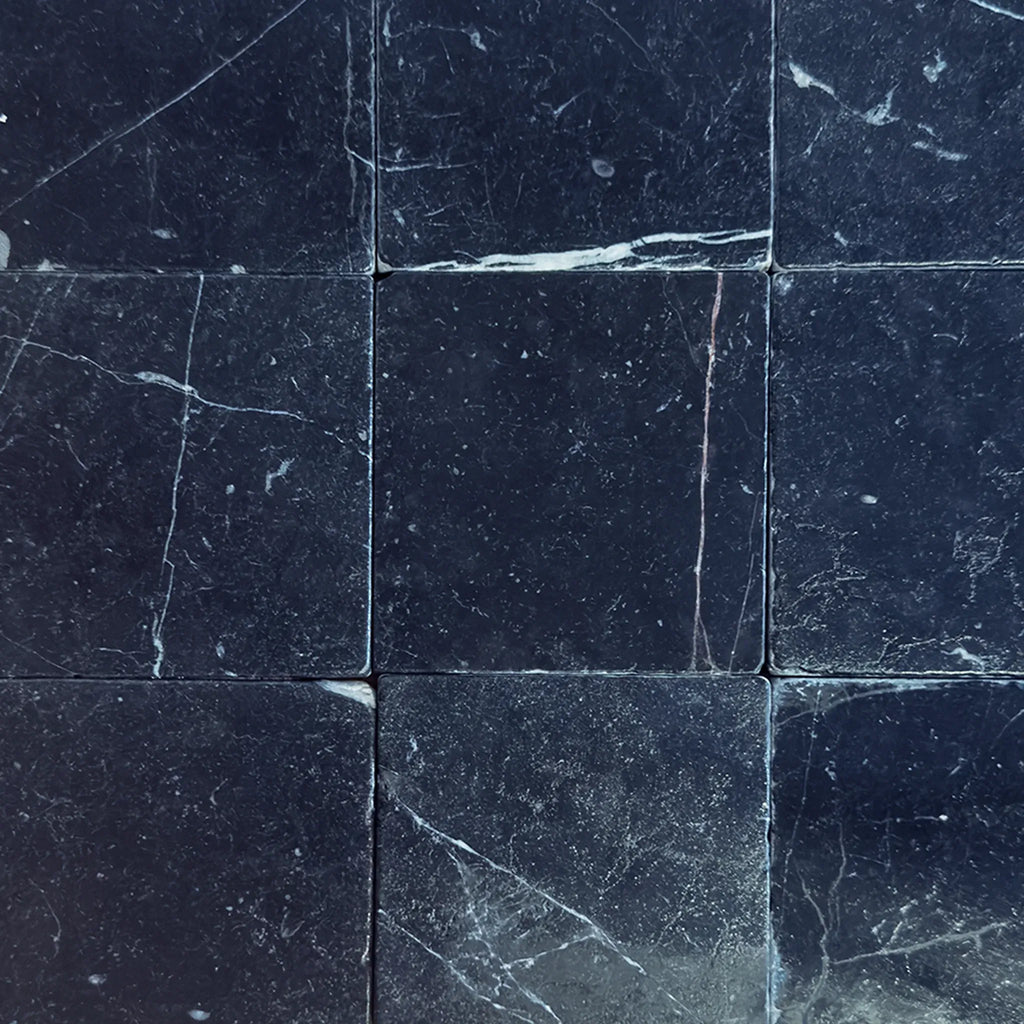 Dark marble tile pattern of Nero Marquina Black Marble 4X4 Tumbled for elegant decor