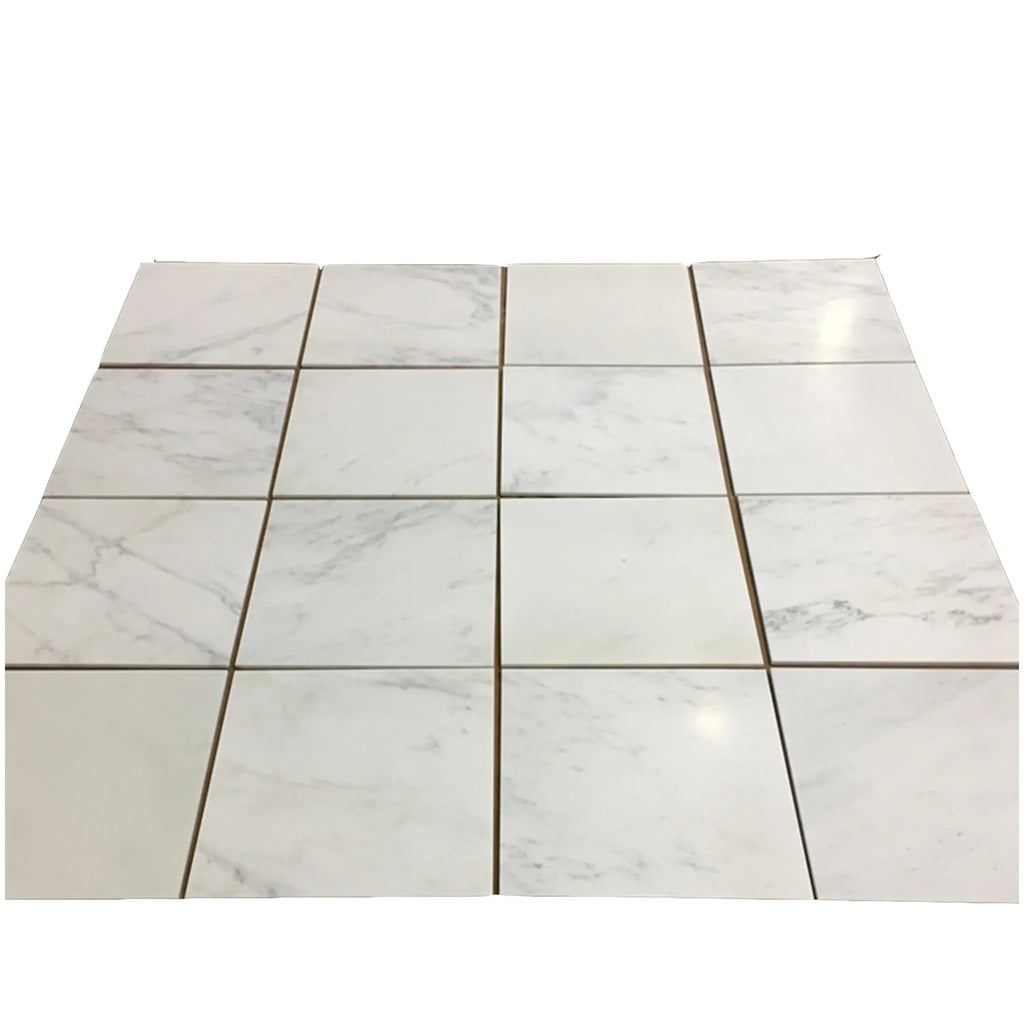 White marble-patterned floor tiles in Oriental White Asian Statuary quarter-round trim