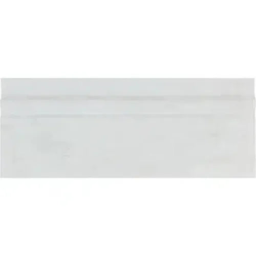 White business envelope displayed with Oriental White Asian Statuary baseboard trim