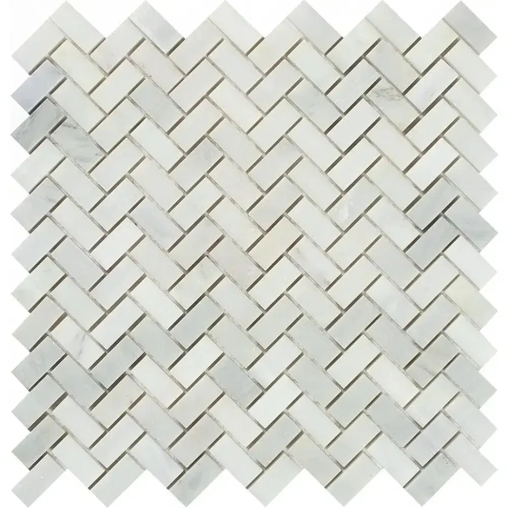 Herringbone pattern of Oriental White marble tiles in polished finish