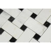 Herringbone pattern of white and black marble tiles in Oriental White Asian Statuary mosaic